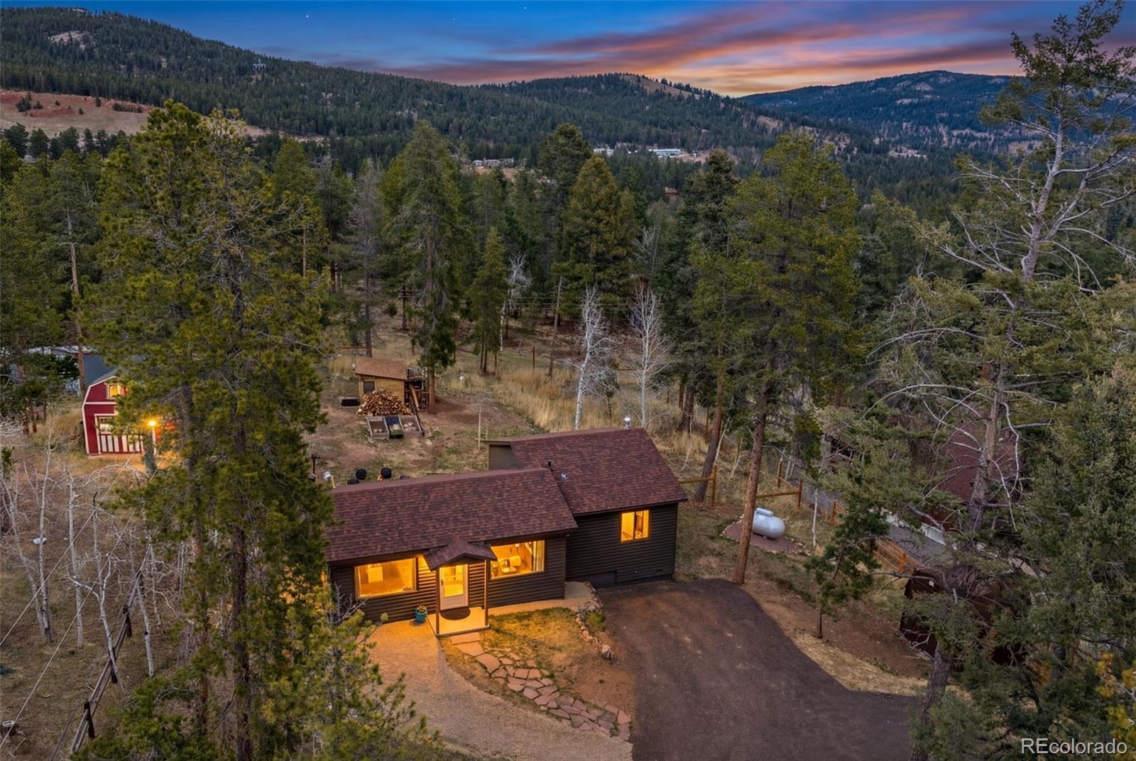 12159 Circle Drive Conifer, CO 80433 - Photo 3 of 49 a view of a terrace with a yard