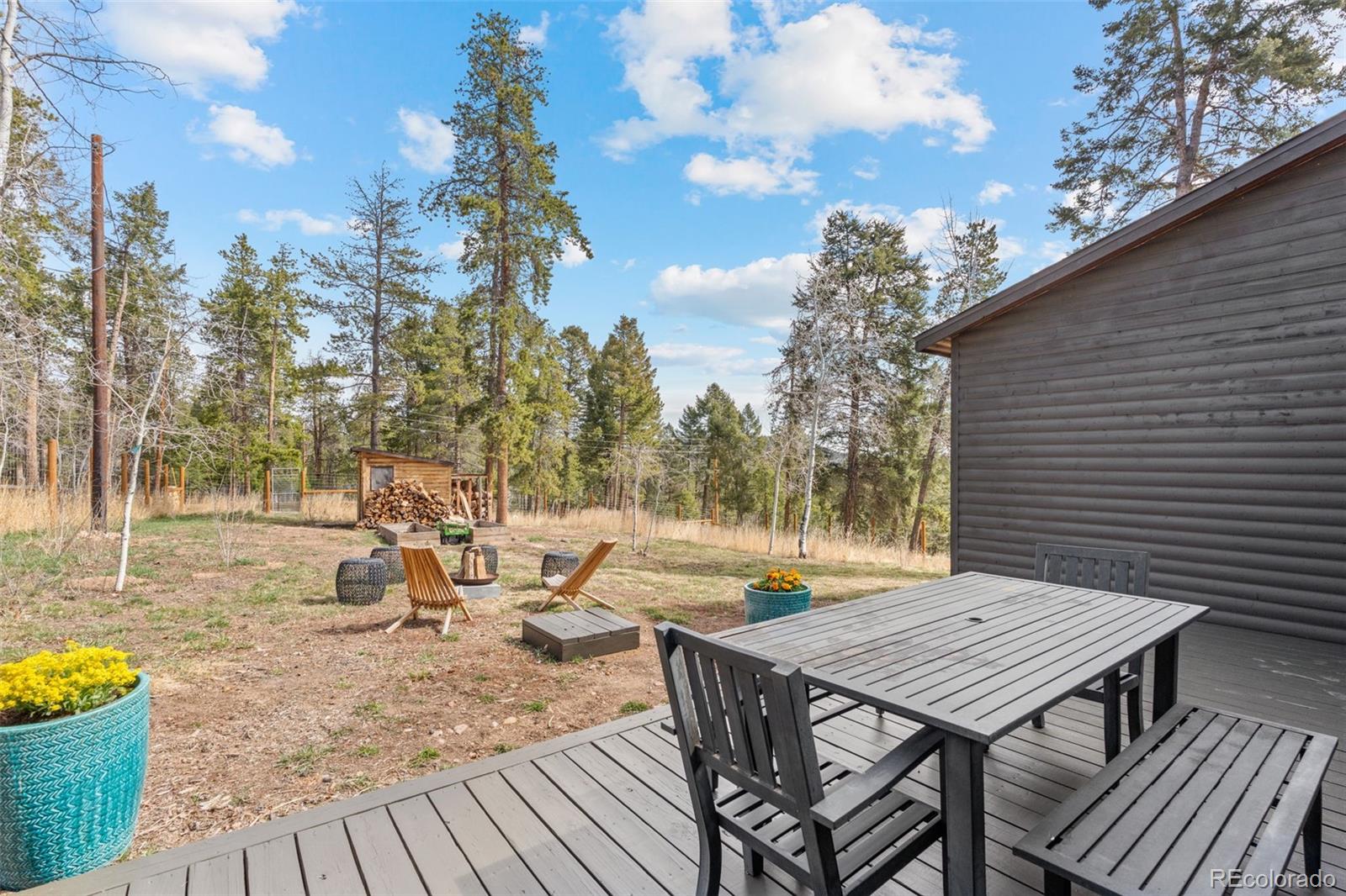 12159 Circle Drive Conifer, CO 80433 - Photo 37 of 49 a view of a backyard with sitting area
