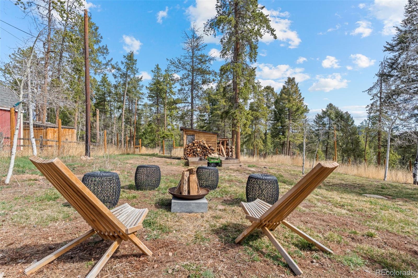 12159 Circle Drive Conifer, CO 80433 - Photo 38 of 49 a view of a patio with iron fence