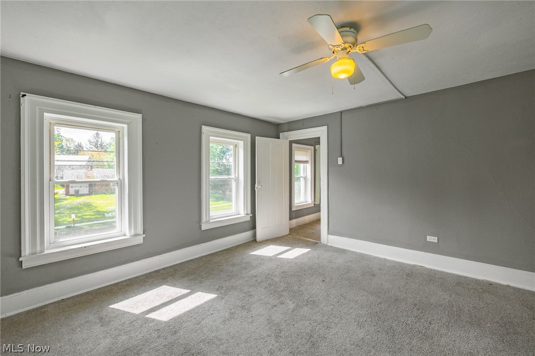 39016 Detroit Road Avon, OH 44011 - Photo 22 of 36 Unfurnished room with carpet floors and ceiling fan