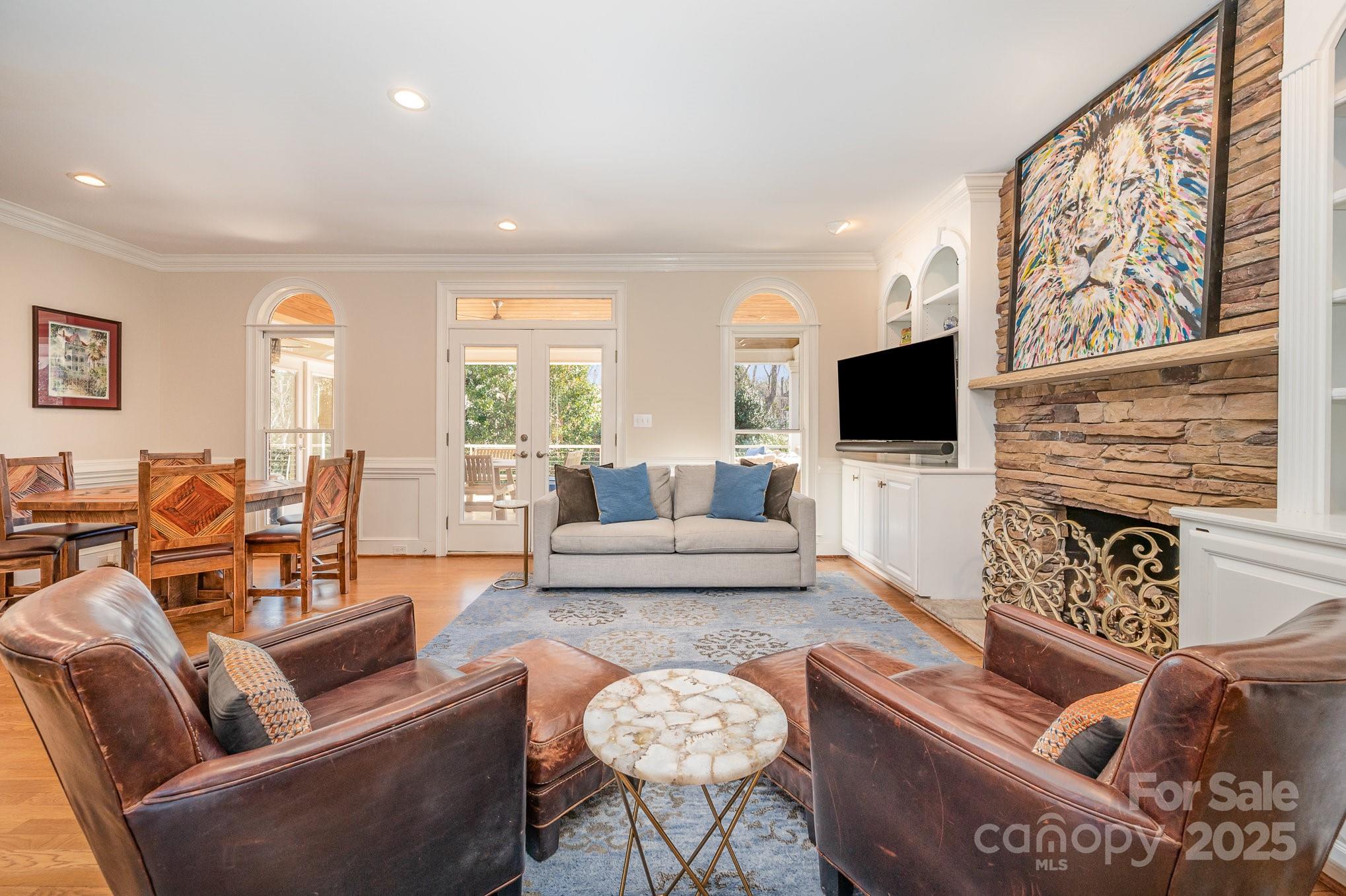 1531 Windy Ridge Road Charlotte, NC 28270 - Photo 23 of 44 a living room with furniture and a flat screen tv
