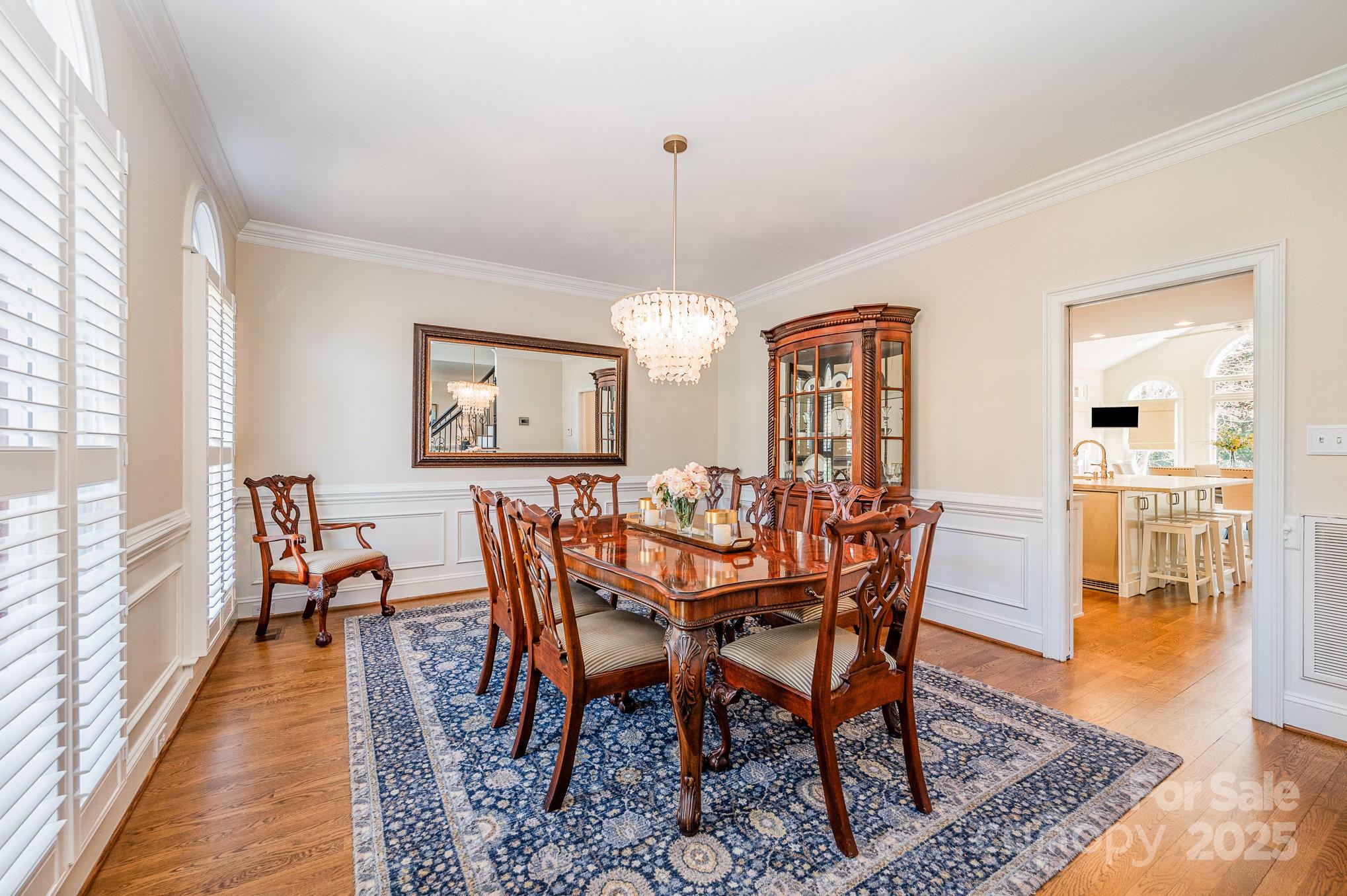 1531 Windy Ridge Road Charlotte, NC 28270 - Photo 28 of 44 a view of a dining room with furniture window and wooden floor