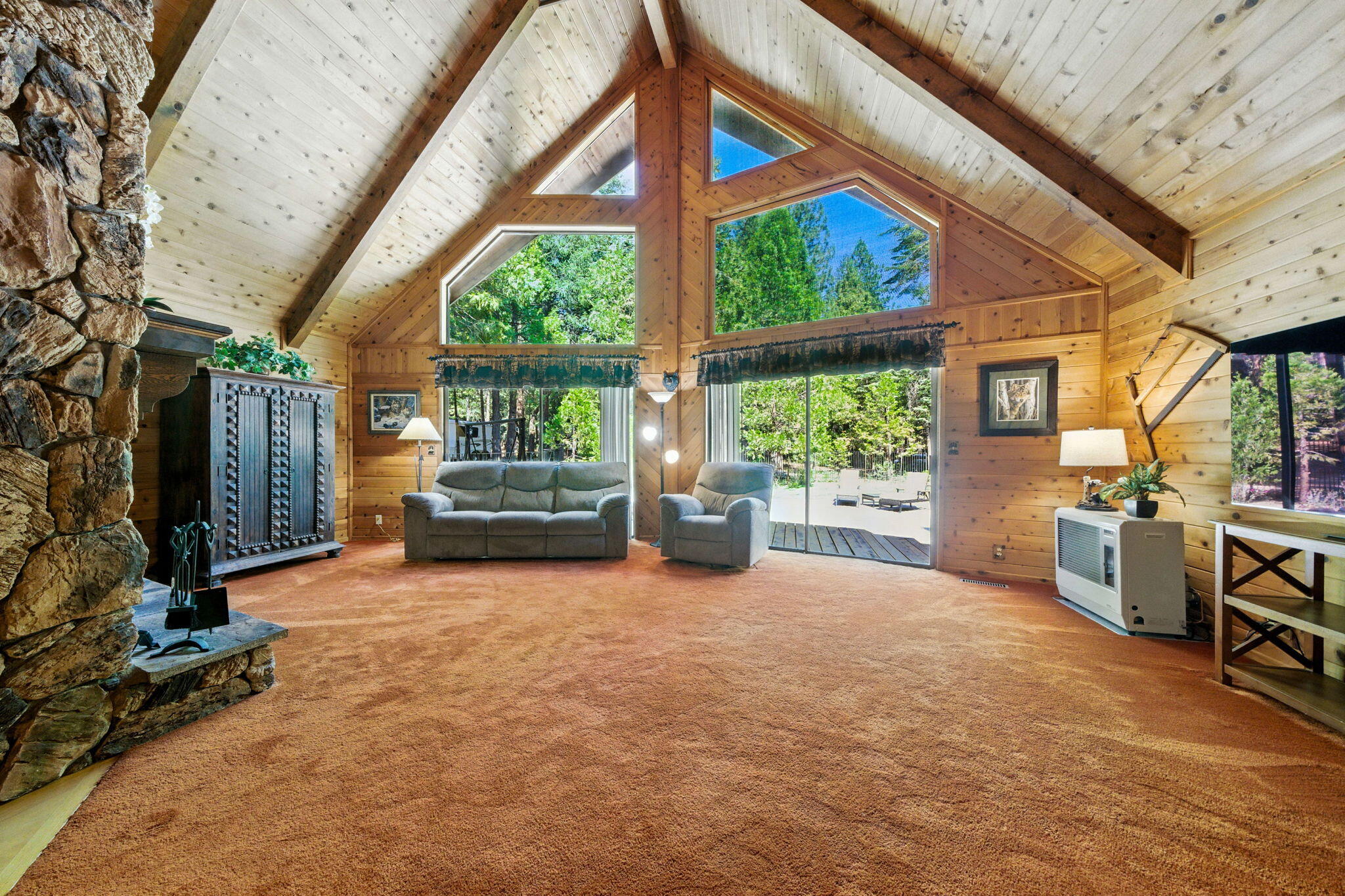 8102 Richards Lane Shingletown, CA 96088 - Photo 5 of 19 a living room with furniture a bed and large windows