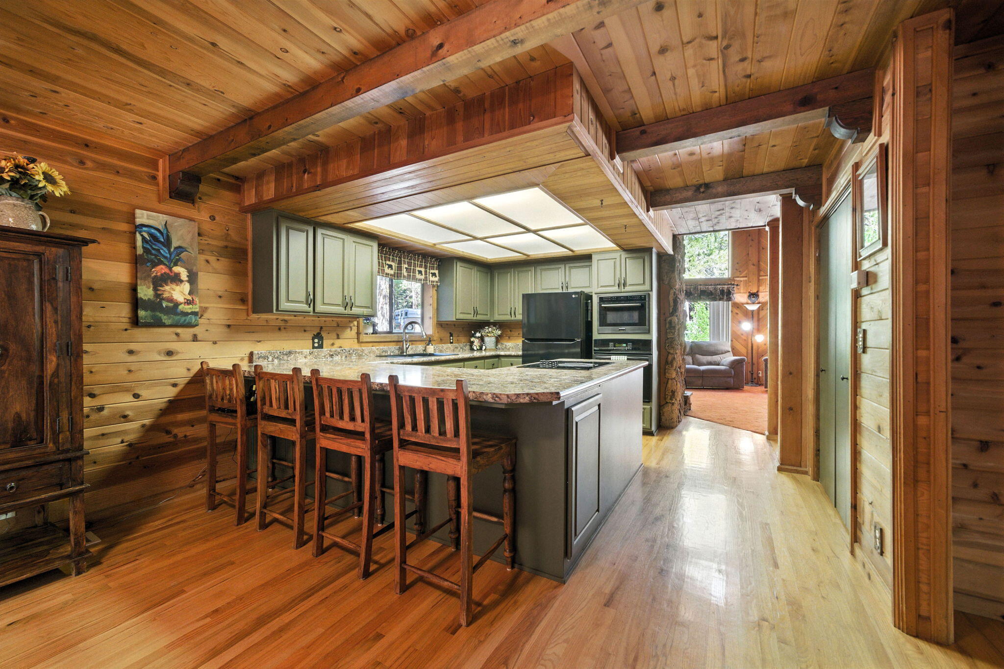 8102 Richards Lane Shingletown, CA 96088 - Photo 7 of 19 a large kitchen with a table and chairs