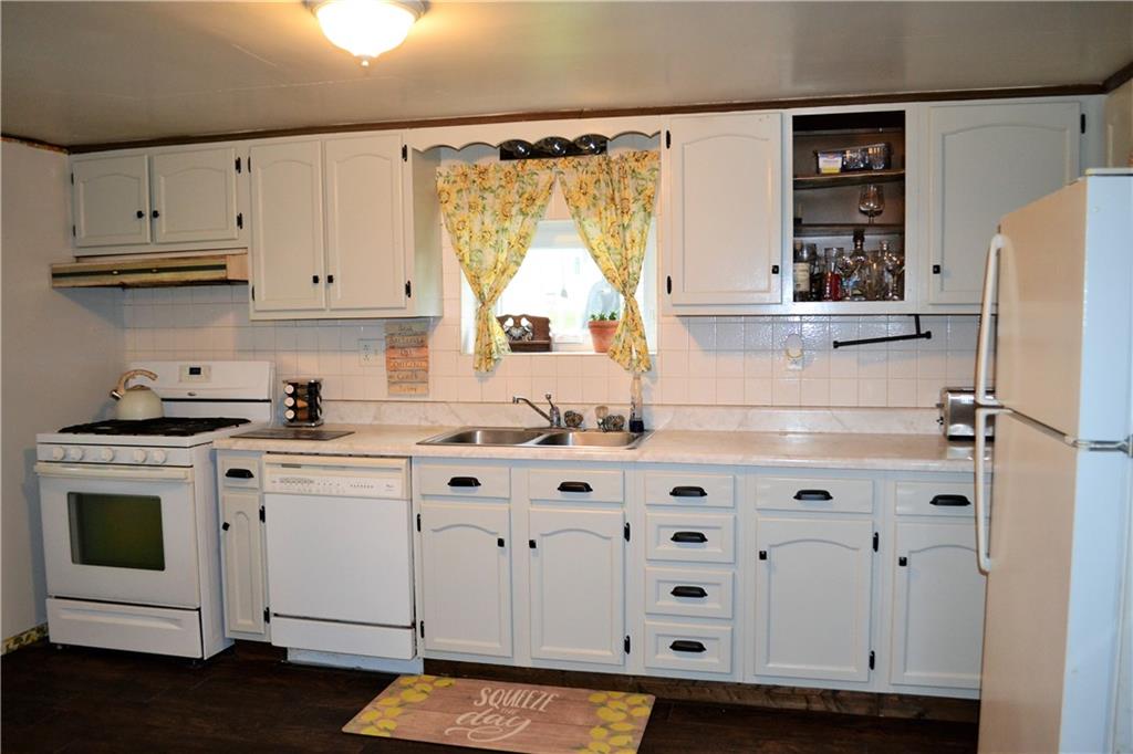 427 Freeport Road Freeport, PA 16229 - Photo 5 of 15 a kitchen with white cabinets and white appliances