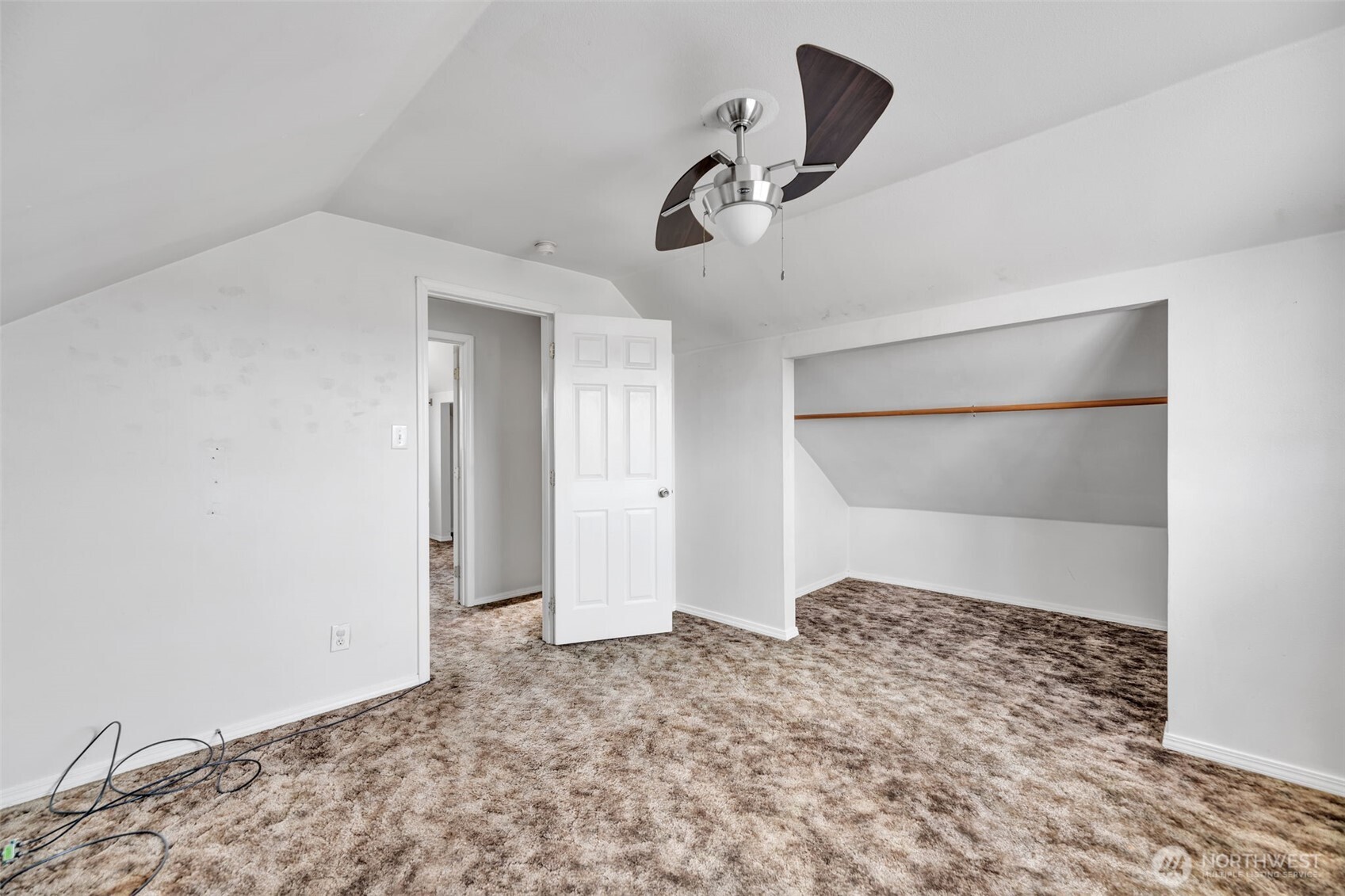 1332 East Marine View Drive Everett, WA 98201 - Photo 11 of 26 a view of a big room with closet and chandelier fan