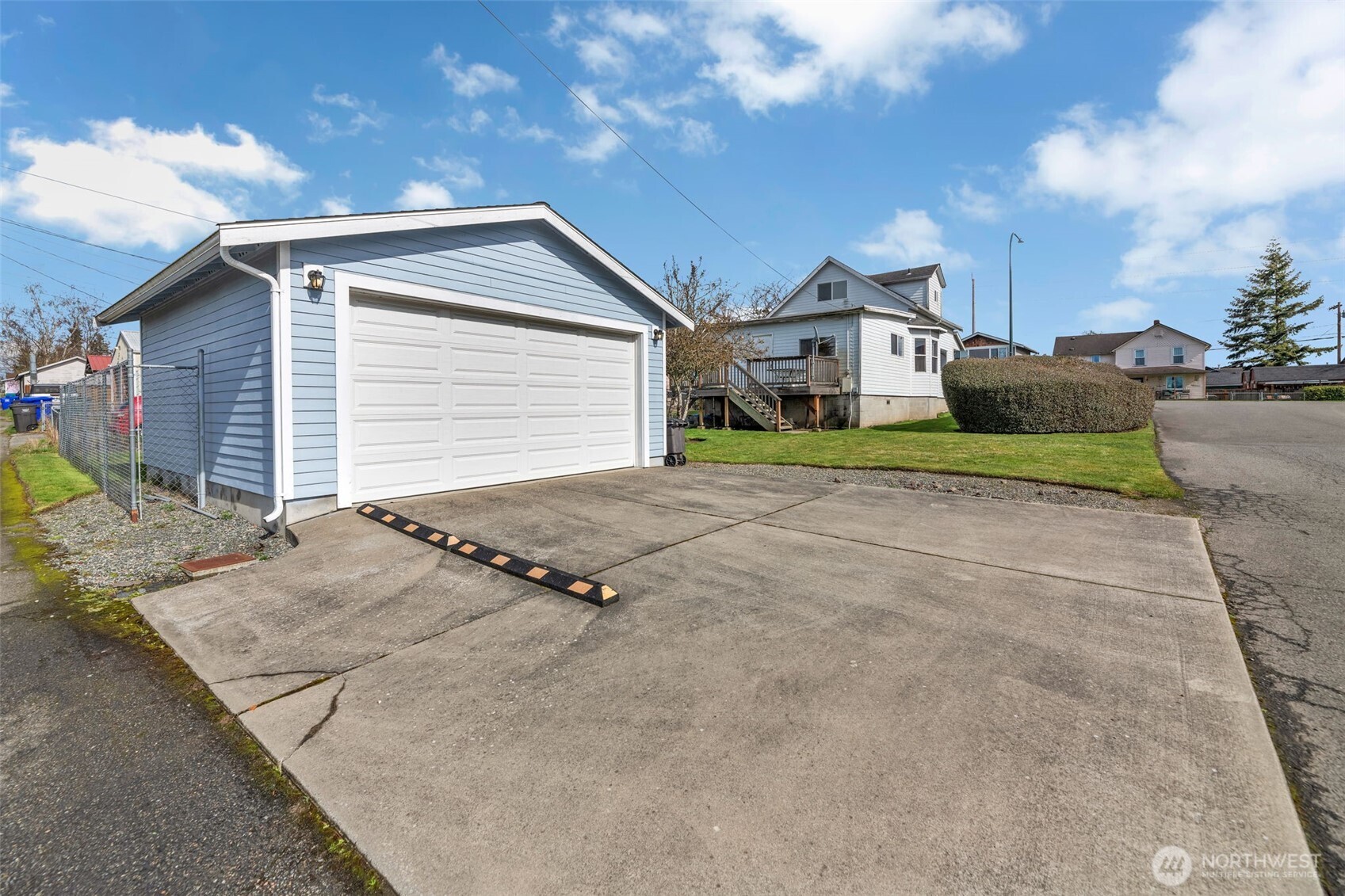1332 East Marine View Drive Everett, WA 98201 - Photo 20 of 26 a front view of a house with a yard and garage