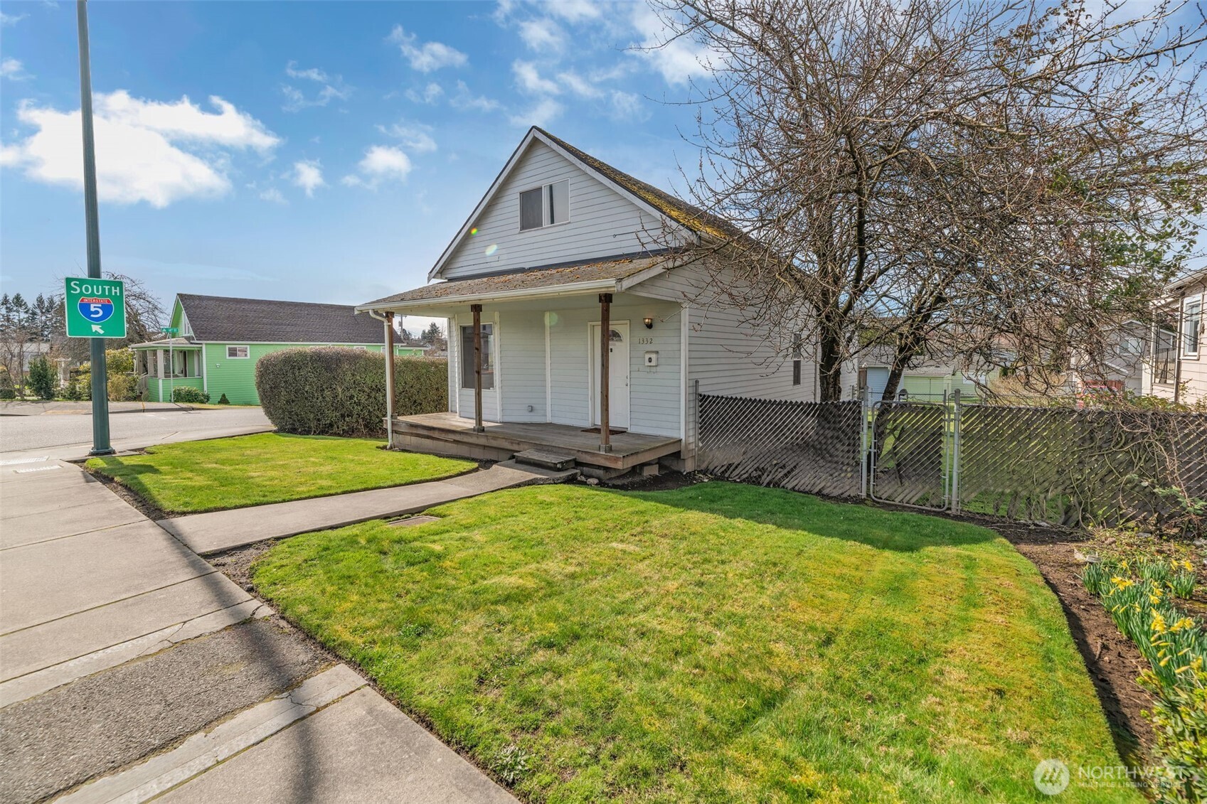 1332 East Marine View Drive Everett, WA 98201 - Photo 24 of 26 a front view of a house with a yard and garage