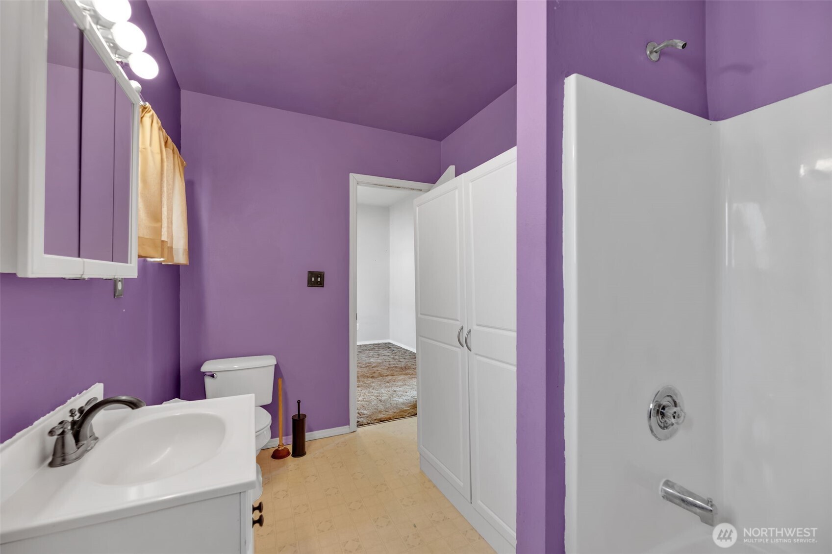 1332 East Marine View Drive Everett, WA 98201 - Photo 6 of 26 a bathroom with a sink and a mirror