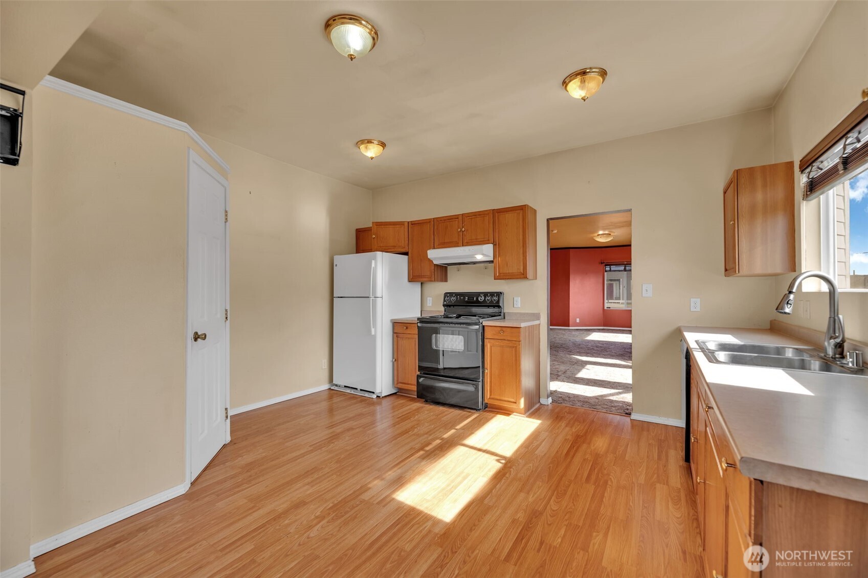 1332 East Marine View Drive Everett, WA 98201 - Photo 8 of 26 a kitchen with a refrigerator and a stove top oven