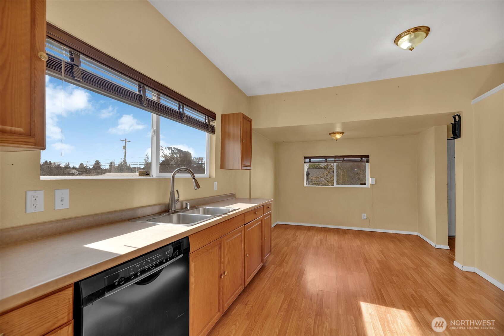 1332 East Marine View Drive Everett, WA 98201 - Photo 9 of 26 a kitchen with a sink and wooden floor