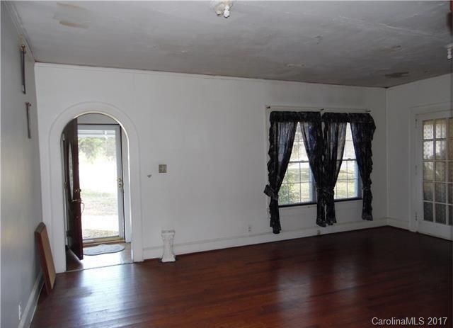 1420 Springdale Road Lancaster, SC 29720 - Photo 2 of 7 an empty room with wooden floor and windows