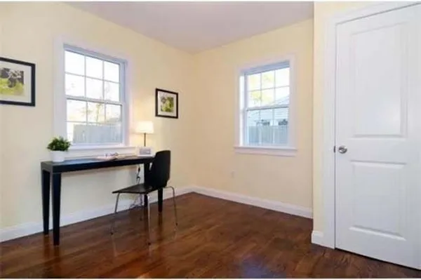 a workspace with furniture and window