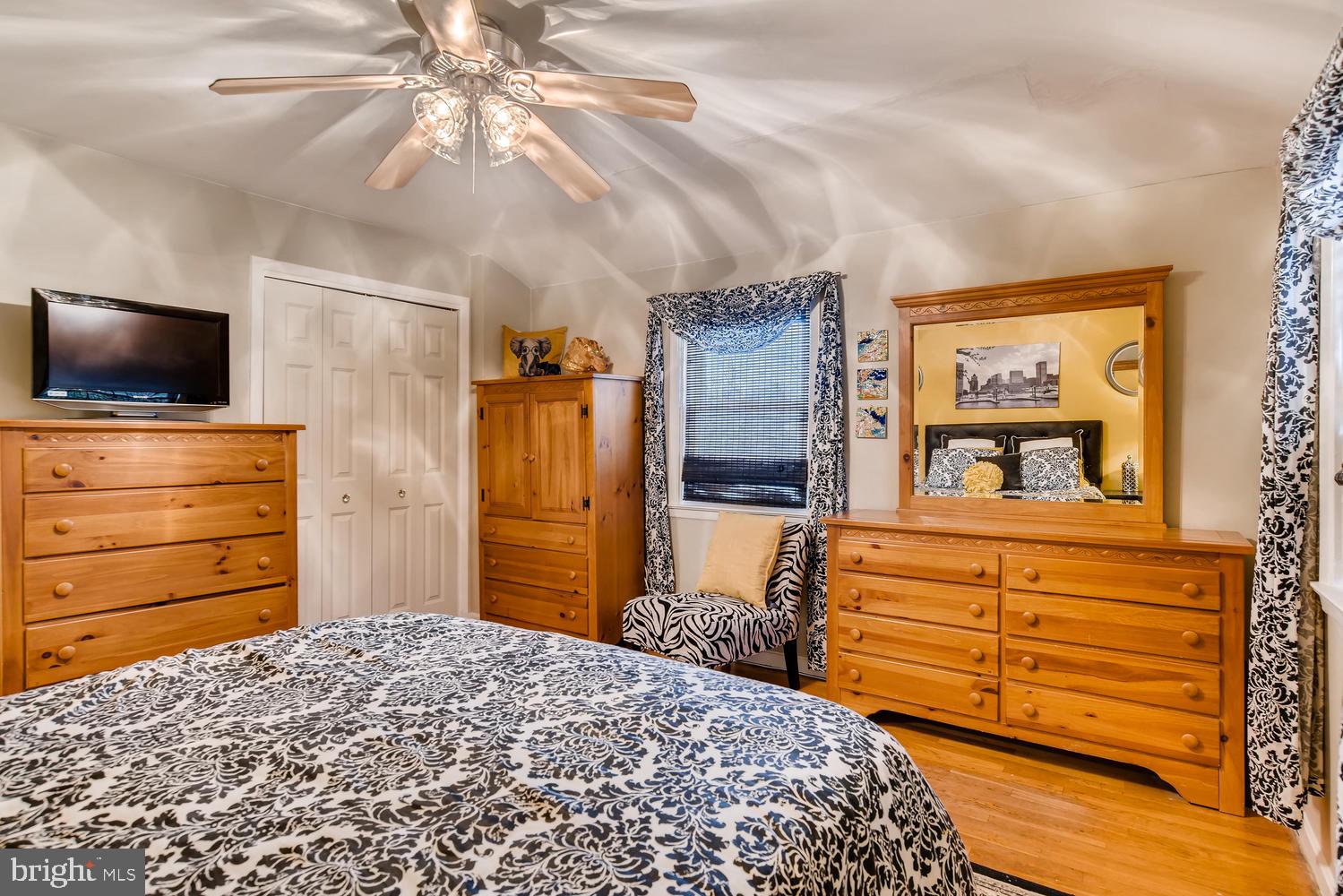 6803 Barnett Road Baltimore, MD 21239 - Photo 12 of 28 MAIN BEDROOM WITH HARDWOOD FLOORS AND CEILING FAN