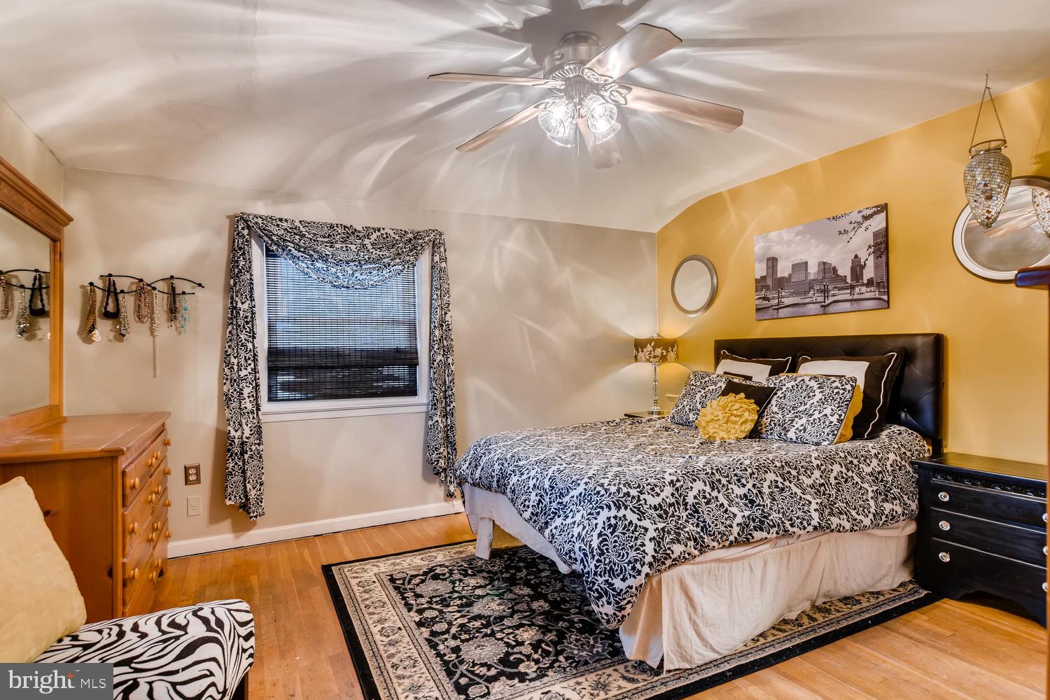 6803 Barnett Road Baltimore, MD 21239 - Photo 13 of 28 MAIN BEDROOM WITH HARDWOOD FLOORS AND CEILING FAN