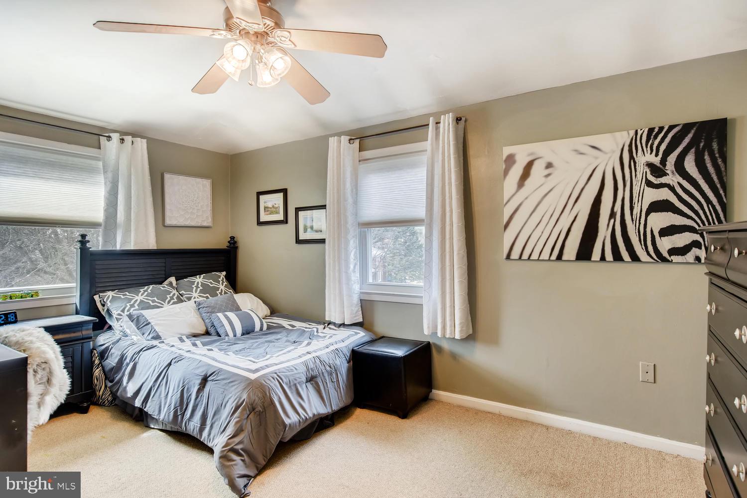 6803 Barnett Road Baltimore, MD 21239 - Photo 18 of 28 FRONT BEDROOM WITH CARPET AND CEILING FAN