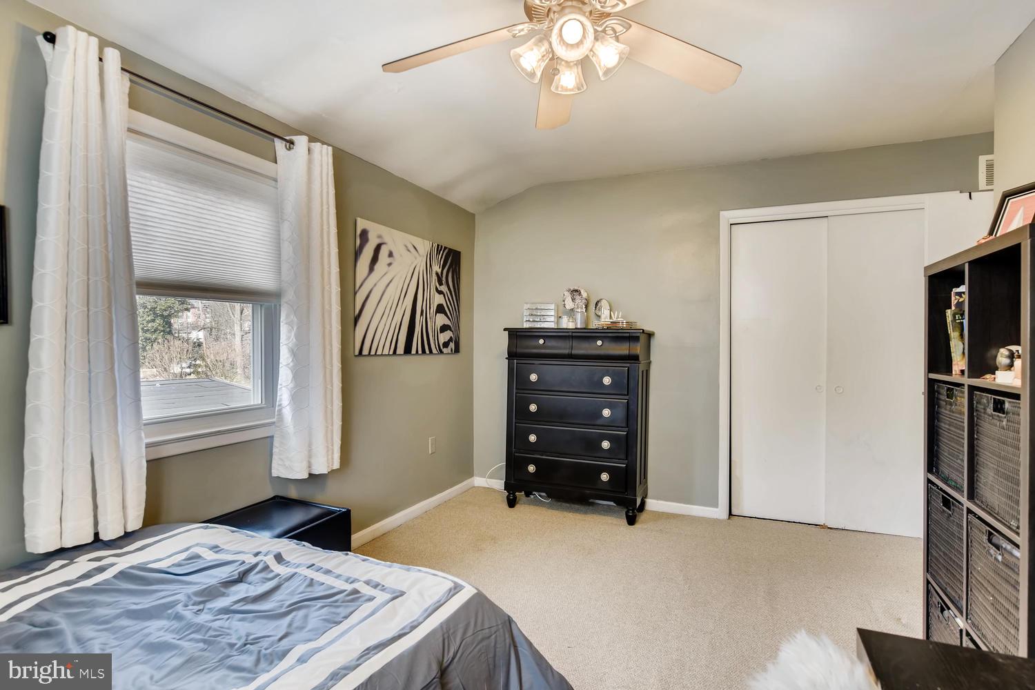 6803 Barnett Road Baltimore, MD 21239 - Photo 19 of 28 FRONT BEDROOM WITH CARPET AND CEILING FAN