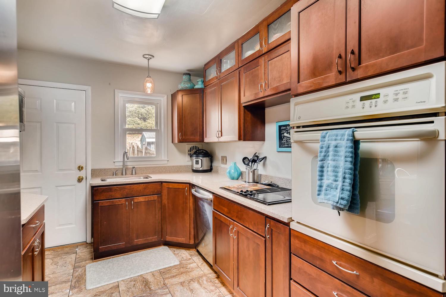 6803 Barnett Road Baltimore, MD 21239 - Photo 9 of 28 GALLEY KITCHEN WITH PLENTY OF STORAGE SPACE