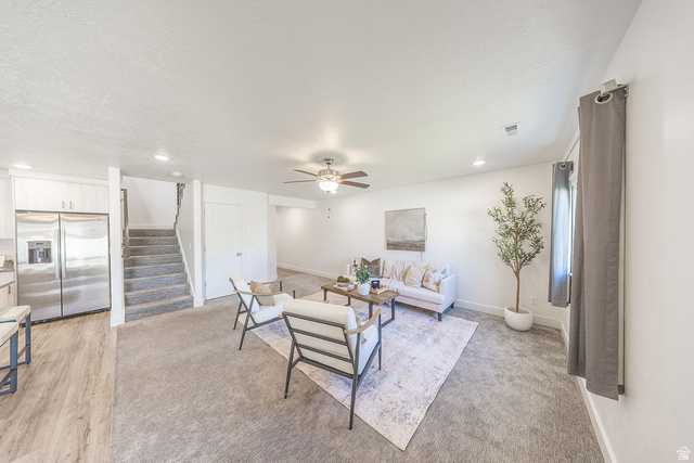 4991 South 475 West Washington Terrace, UT 84405 - Photo 13 of 31 Spacious living area featuring light-toned carpeting and recessed lighting