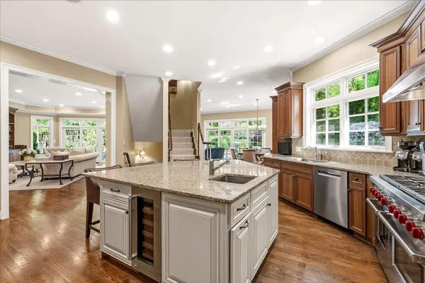 a kitchen with a sink stove and cabinets