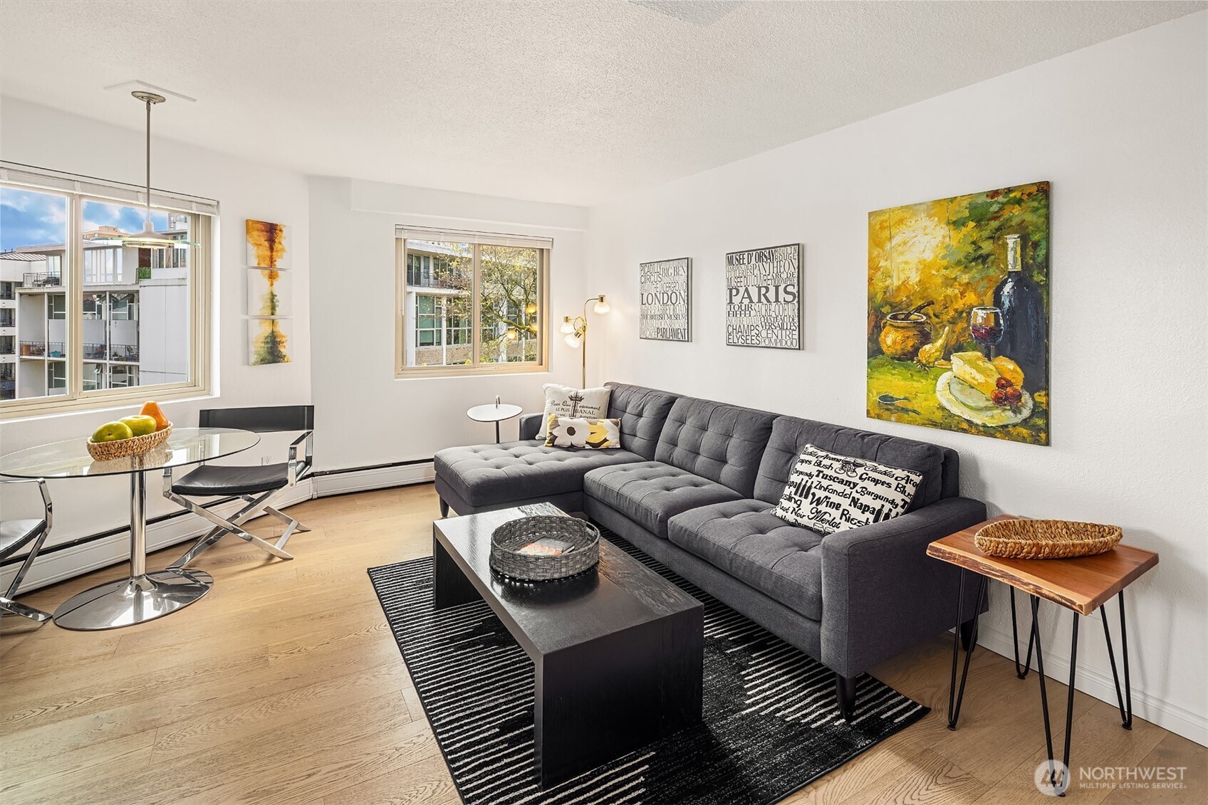 1400 Hubbell Place, Unit 1411 Seattle, WA 98101 - Photo 1 of 25 a living room with furniture and a window