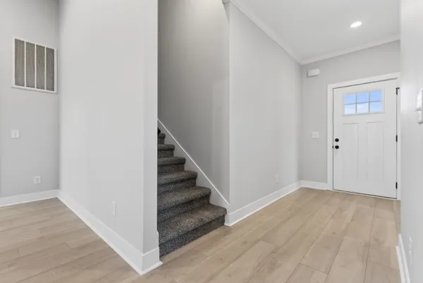 an empty room with a empty space and a ceiling fan