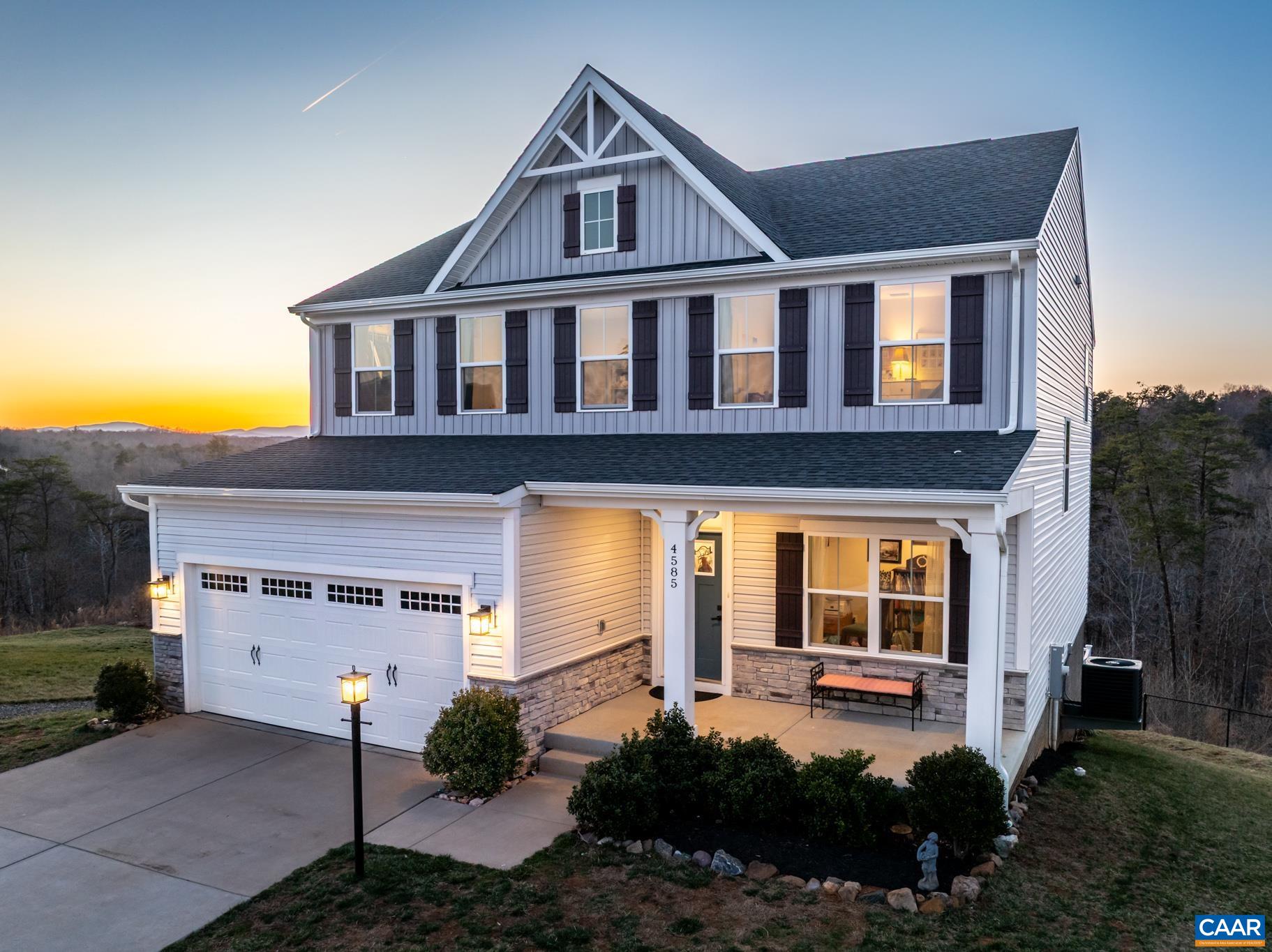 4585 Sunset Drive Charlottesville, VA 22911 - Photo 2 of 70 a front view of a house with a yard and garage
