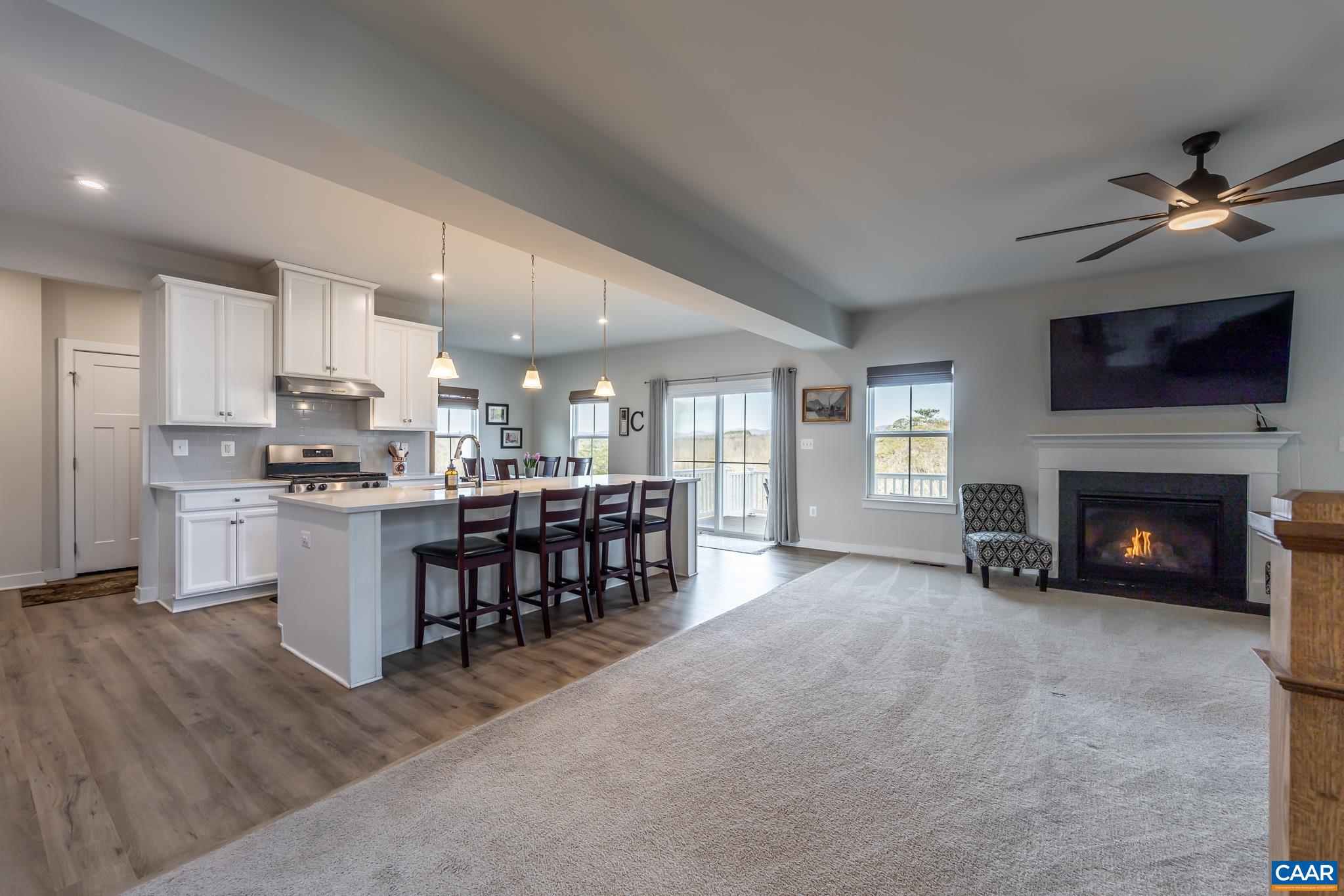 4585 Sunset Drive Charlottesville, VA 22911 - Photo 22 of 70 a kitchen with a table chairs a fireplace and a window