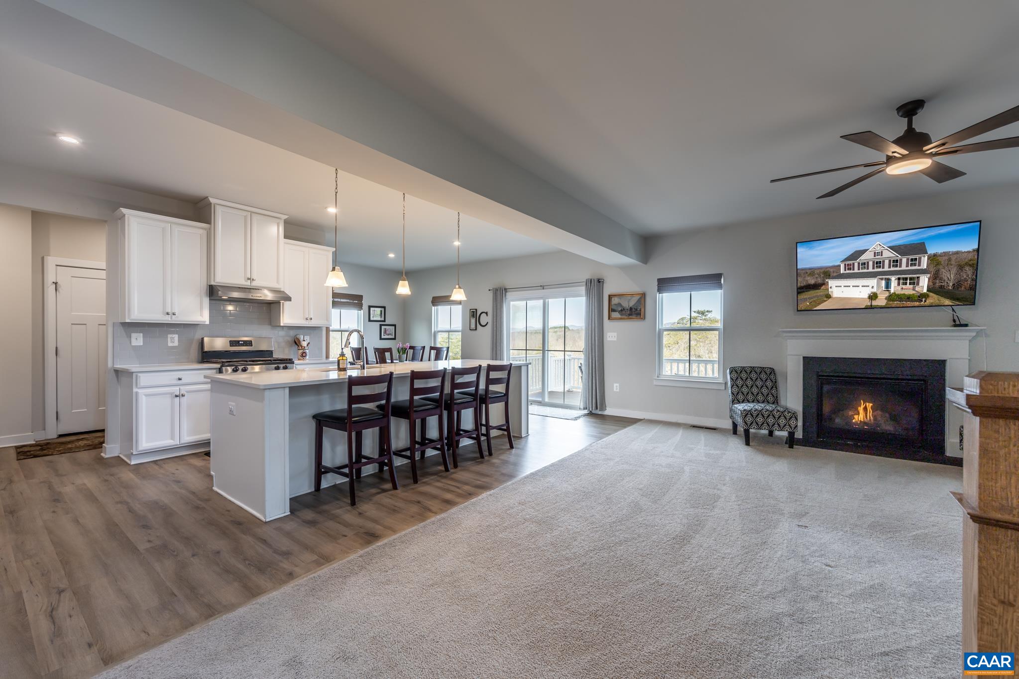 4585 Sunset Drive Charlottesville, VA 22911 - Photo 23 of 70 a living room with furniture a fireplace and kitchen view