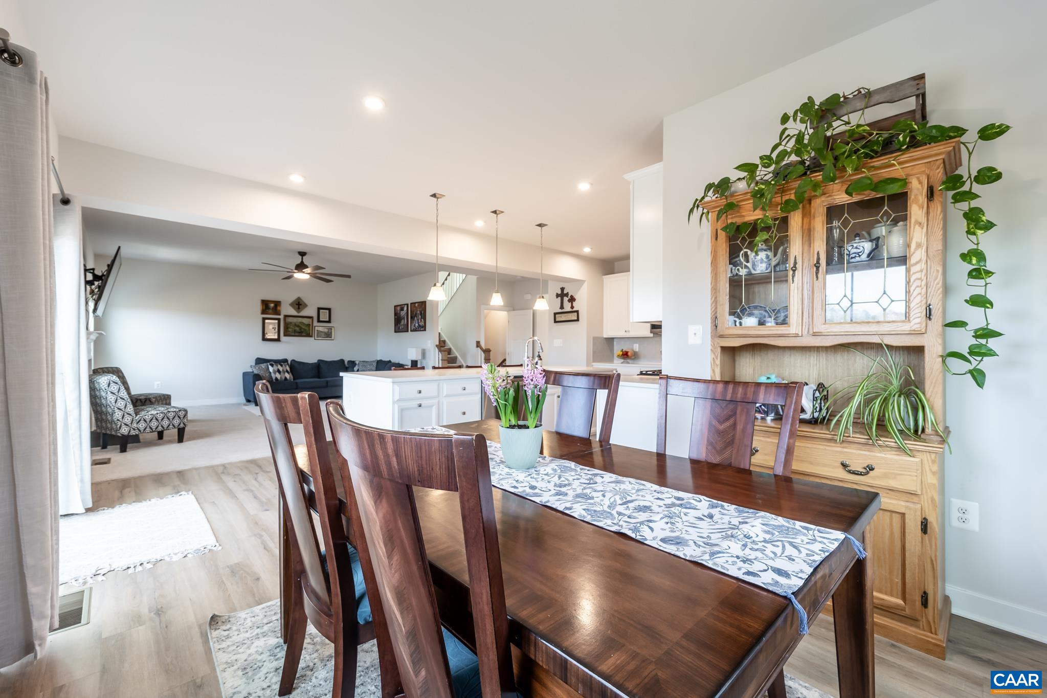 4585 Sunset Drive Charlottesville, VA 22911 - Photo 27 of 70 a view of a dining room and livingroom with furniture wooden floor a rug and a chandelier