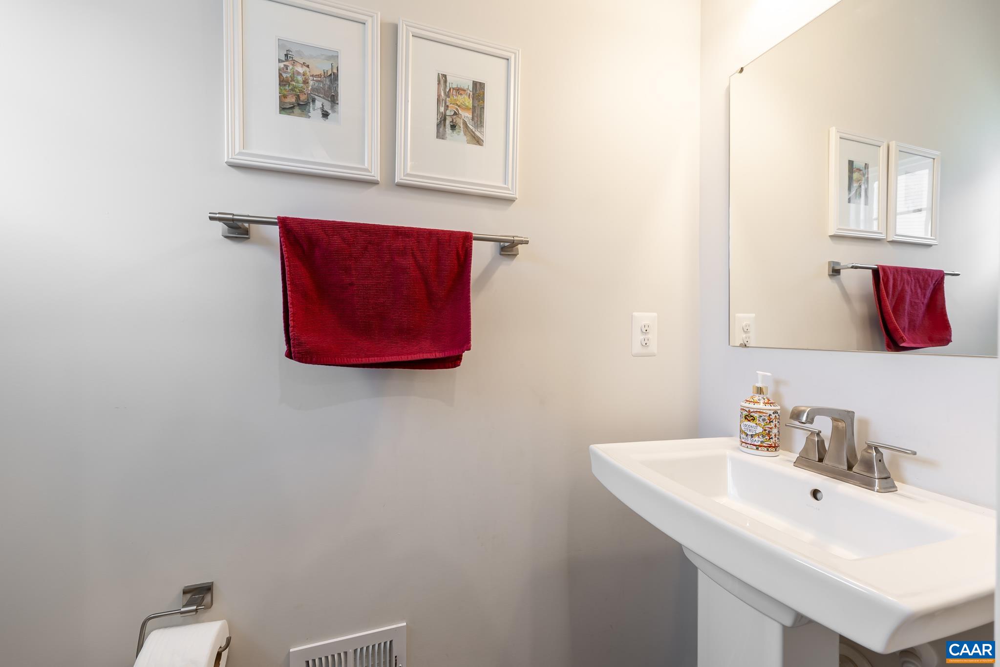 4585 Sunset Drive Charlottesville, VA 22911 - Photo 36 of 70 a bathroom with a sink and a mirror