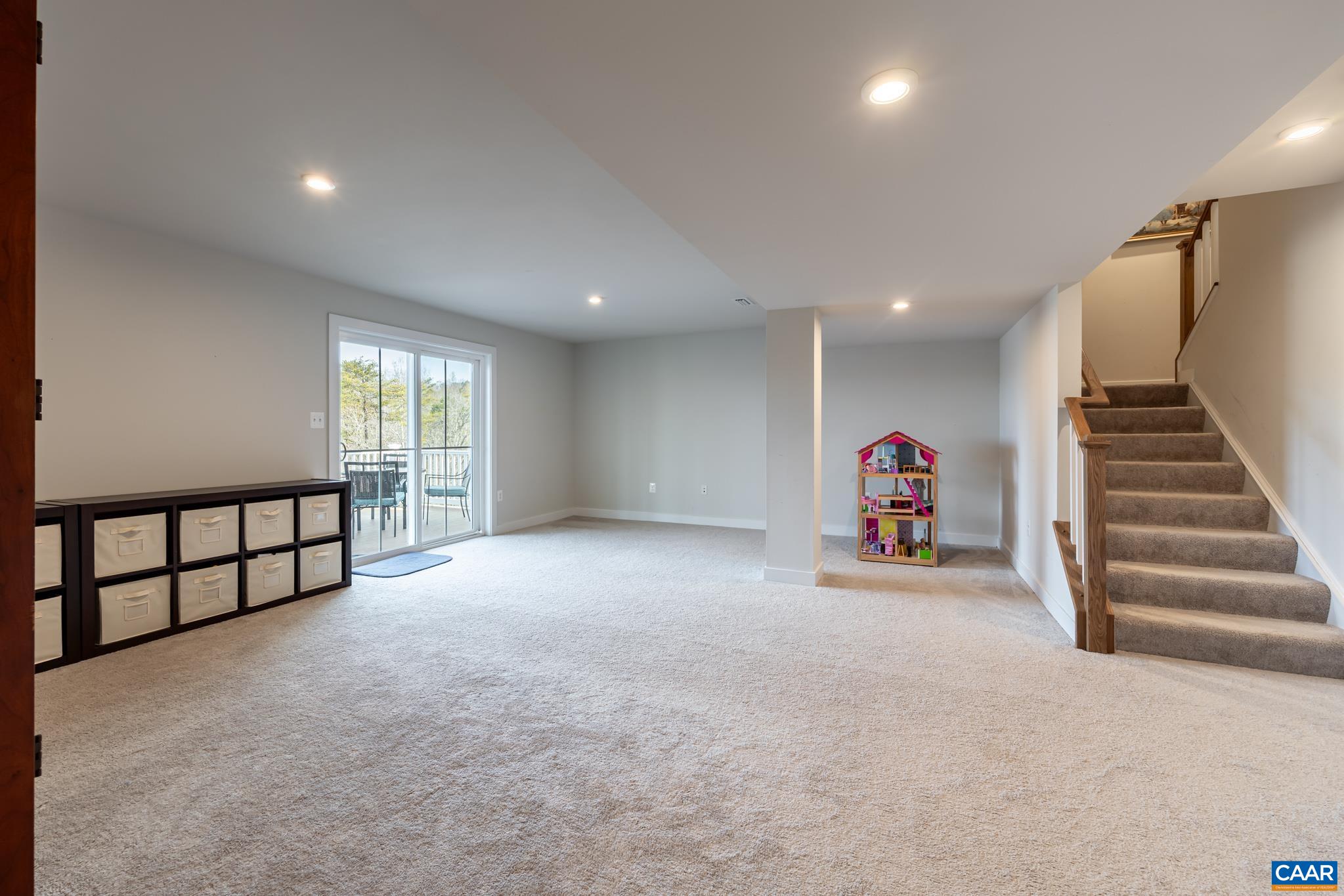 4585 Sunset Drive Charlottesville, VA 22911 - Photo 51 of 70 a view of an empty room with stairs and toys