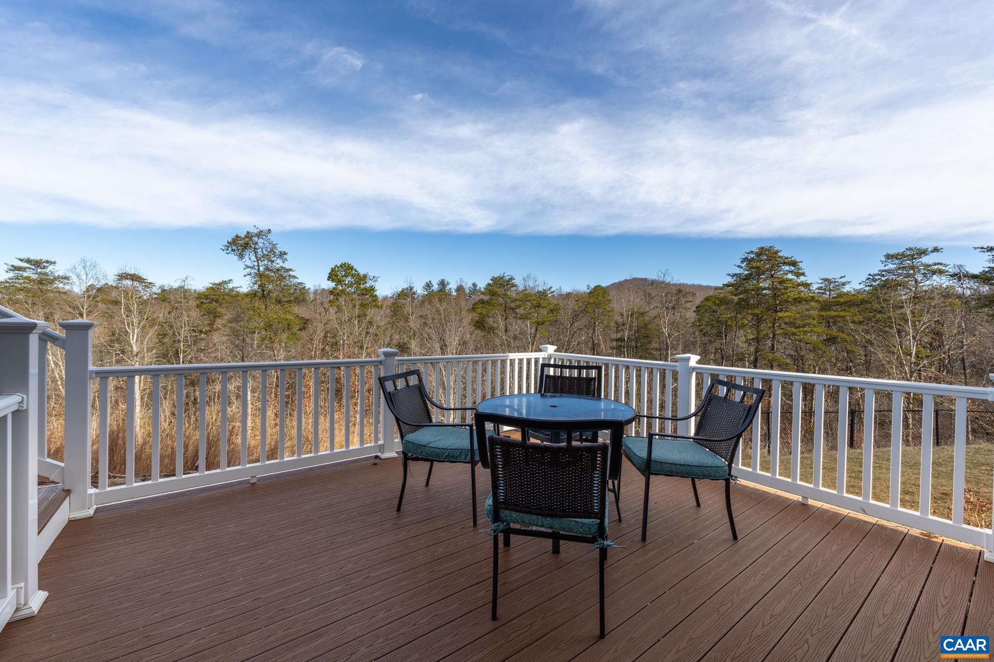 4585 Sunset Drive Charlottesville, VA 22911 - Photo 52 of 70 a view of a chair and table on the wooden deck