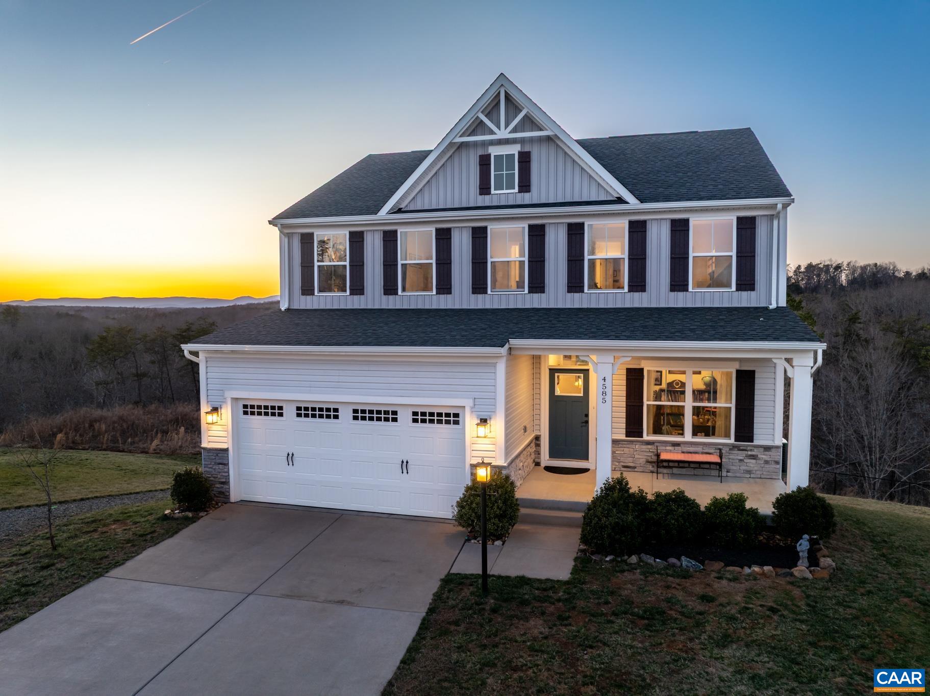 4585 Sunset Drive Charlottesville, VA 22911 - Photo 59 of 70 a front view of a house with a yard and garage