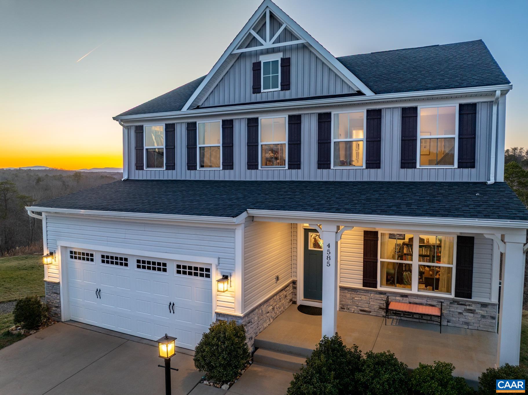 4585 Sunset Drive Charlottesville, VA 22911 - Photo 60 of 70 a front view of a house with glass windows and a table