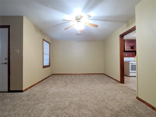 a view of an empty room with a window