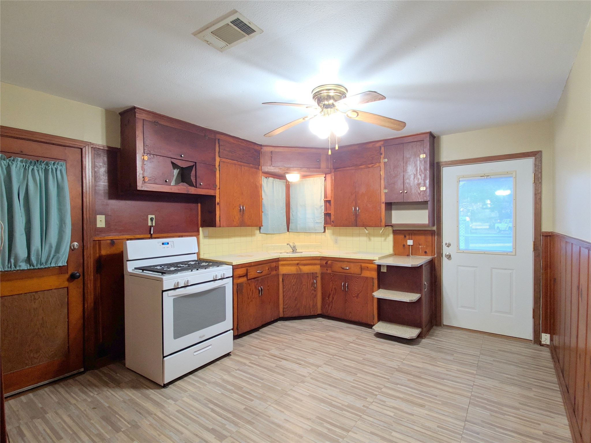 1717 Hawthorne Street La Marque, TX 77568 - Photo 6 of 11 a kitchen with stainless steel appliances granite countertop a stove oven and a refrigerator
