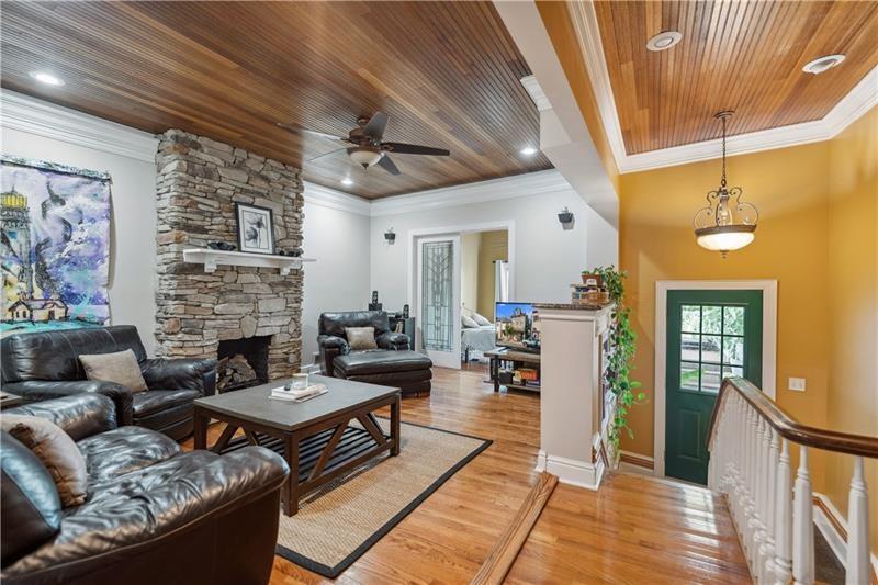167 Pius Street Pittsburgh, PA 15203 - Photo 22 of 49 a living room with fireplace furniture and a wooden floor