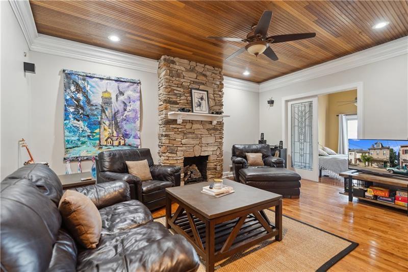 167 Pius Street Pittsburgh, PA 15203 - Photo 23 of 49 a living room with furniture a table and a fireplace