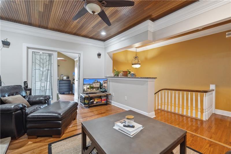 167 Pius Street Pittsburgh, PA 15203 - Photo 25 of 49 a living room with furniture and wooden floor