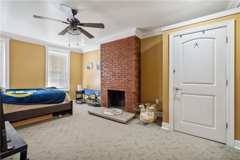 167 Pius Street Pittsburgh, PA 15203 - Photo 26 of 49 a living room with furniture and a fireplace