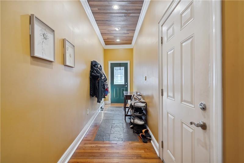 167 Pius Street Pittsburgh, PA 15203 - Photo 3 of 49 a hallway with wooden floor and closet