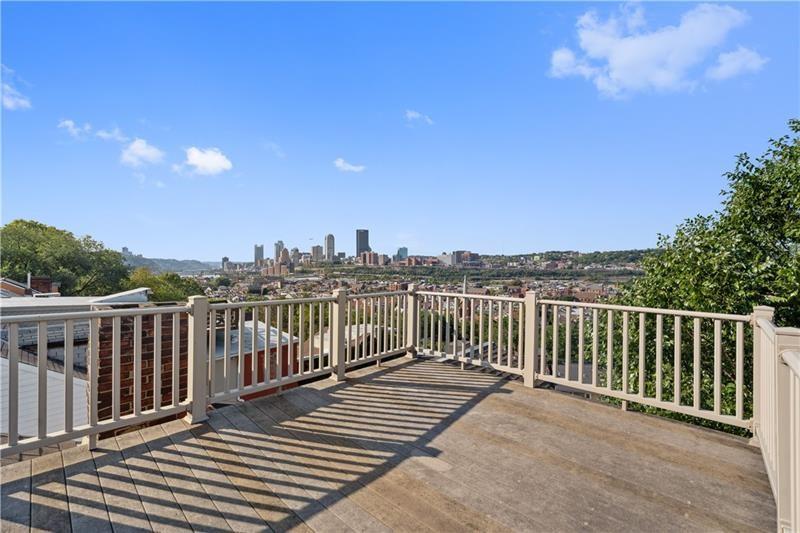 167 Pius Street Pittsburgh, PA 15203 - Photo 40 of 49 a view of a balcony with wooden fence and floor
