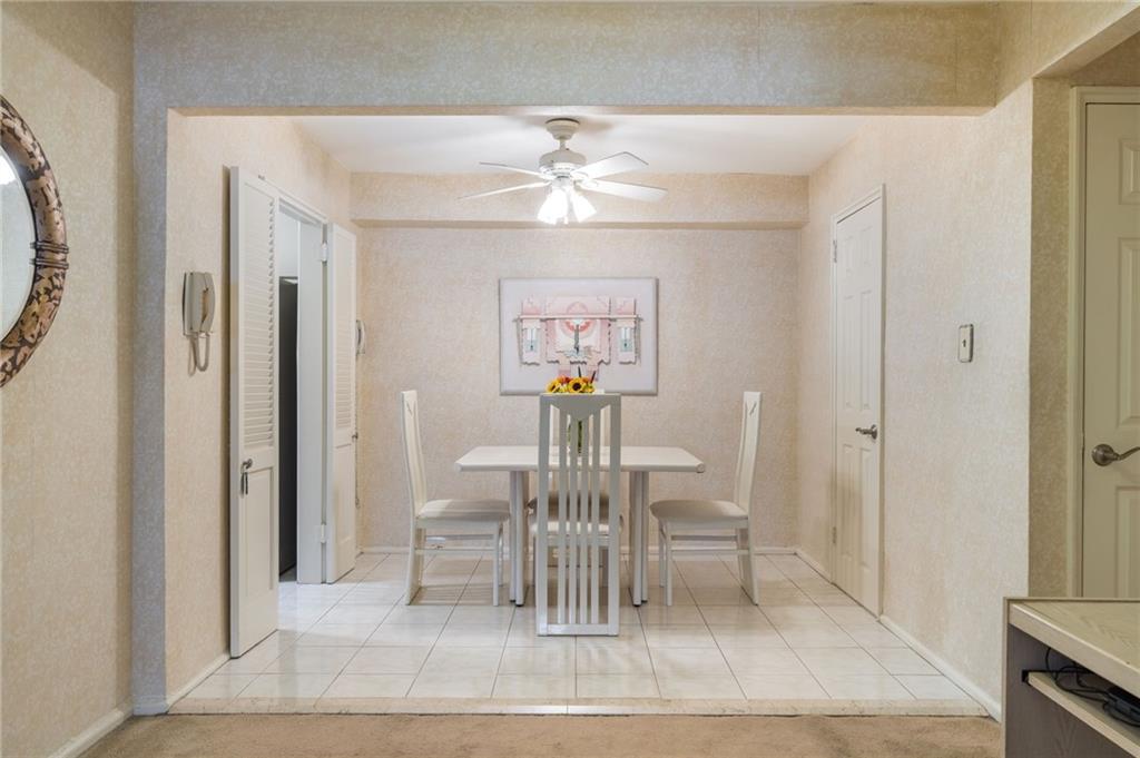 3060 Ocean Avenue, Unit 2L Brooklyn, NY 11235 - Photo 4 of 13 a dining room with furniture and chandelier