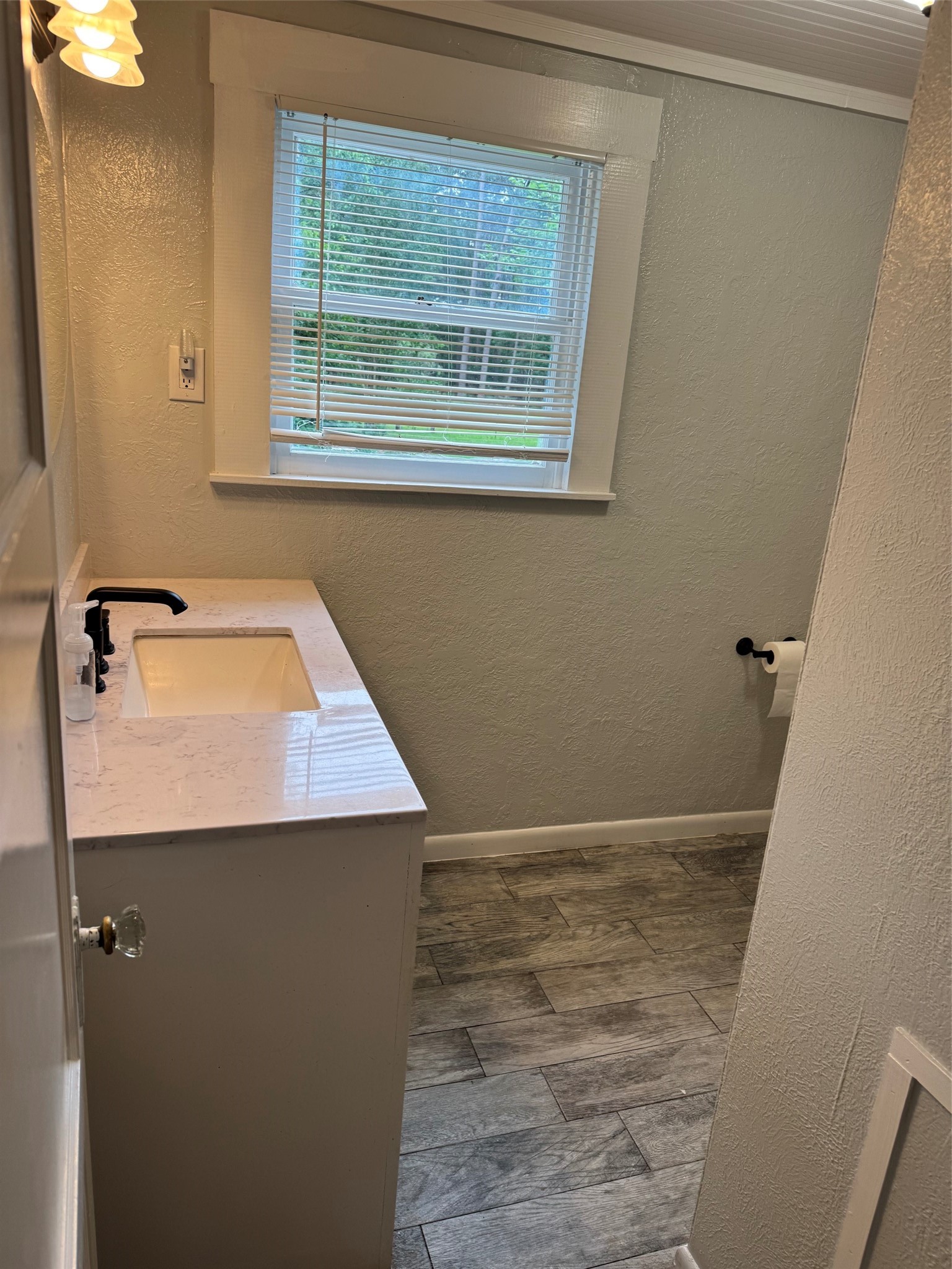9004 Farm To Market 62 Corrigan, TX 75939 - Photo 23 of 27 a bathroom with a sink and a window