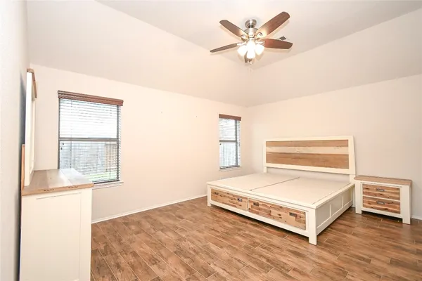 a living room with a bed furniture and a window