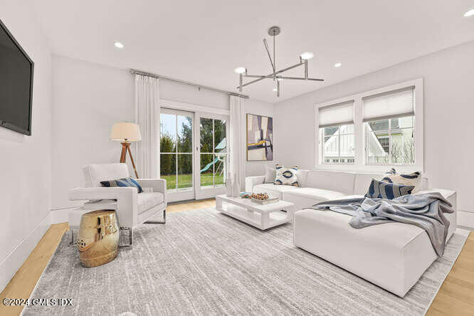 63 Valleywood Road Cos Cob, CT 06807 - Photo 13 of 34 a bedroom with furniture and a large window