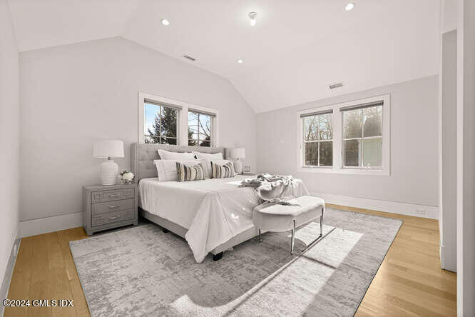63 Valleywood Road Cos Cob, CT 06807 - Photo 18 of 34 a bedroom with a bed and wooden floor