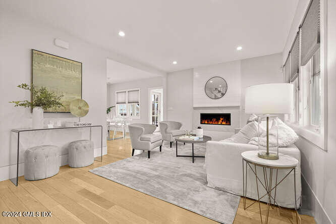 63 Valleywood Road Cos Cob, CT 06807 - Photo 5 of 34 a living room with furniture a table and potted plant