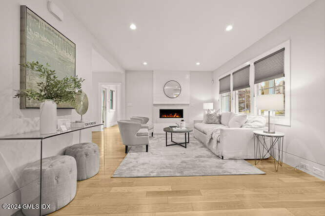 63 Valleywood Road Cos Cob, CT 06807 - Photo 6 of 34 a living room with furniture and a wooden floor
